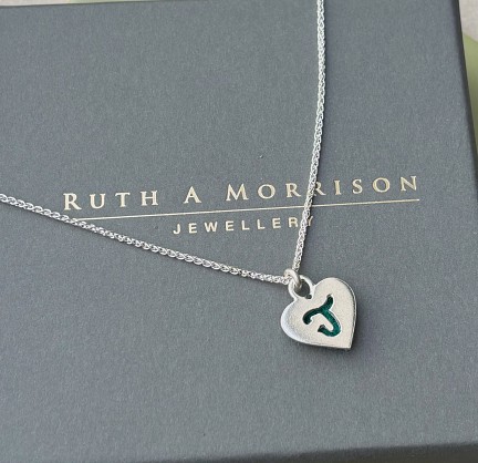 Sterling Silver and Harris Tweed - approx 18mmwith an 18inch chain.
You can choose any letter - I will email to ask