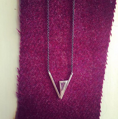 Sterling silver triangle drop necklace with pink Harris Tweed. 