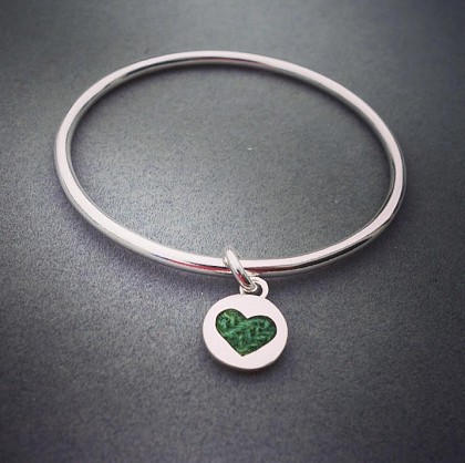 Sterling Silver - 3mm bangle with an 12mm circular heart charm.